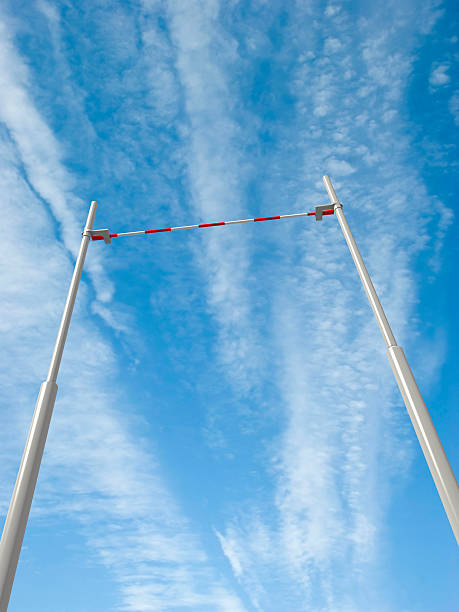 High pole vault bar against the clear blue sky 3d render of the pole vault crossbar on blue sky background horizontal bar stock pictures, royalty-free photos & images