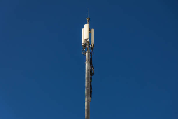 Close up of antenna repeater tower on blue sky. High quality photo
