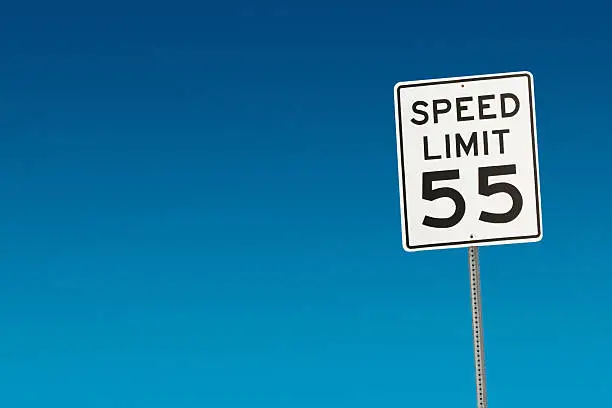 Photo of Speed limit sign posted displaying 55 mph