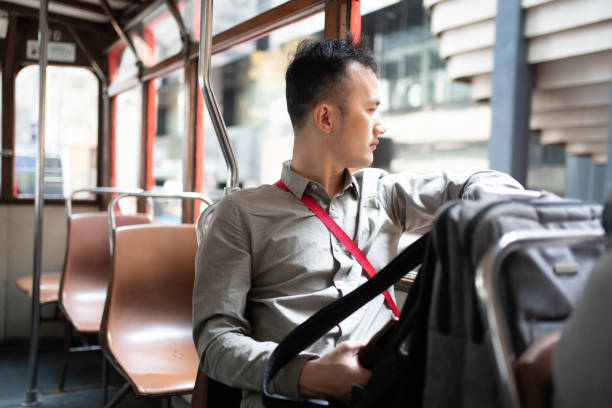 istock Asian man rides public transportation 1473168099