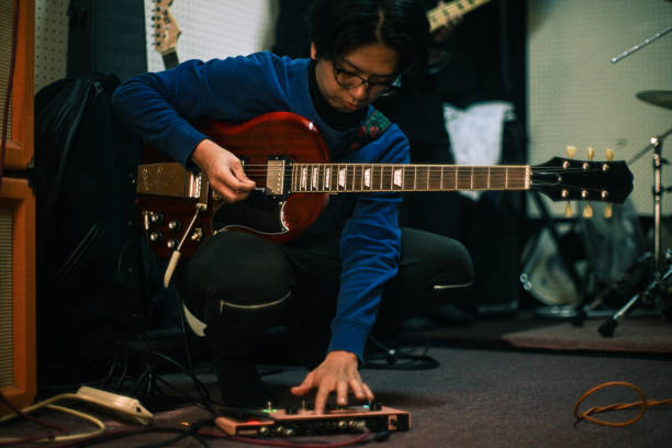 istock A young guitarist setting up the guitar effect pedal 1473168642