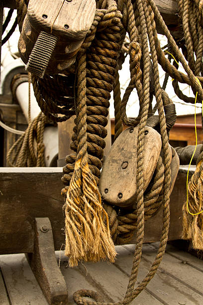 istock Old rope and wooden block pulleys 147316887