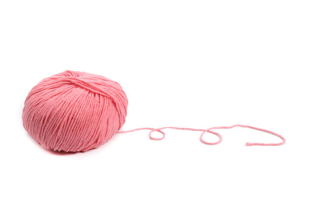 istock Pink wool yarn ball isolated on white 1473169877