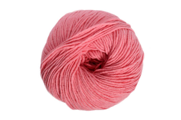 istock Pink wool yarn ball isolated on white 1473169878