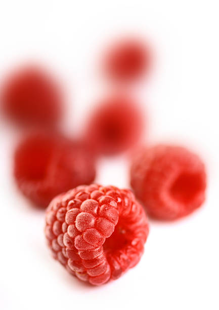 raspberries on white background stock photo