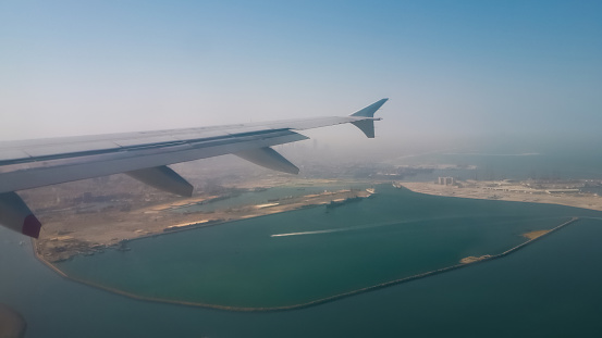 Flight to Dubai city and the outskirts of the city from above