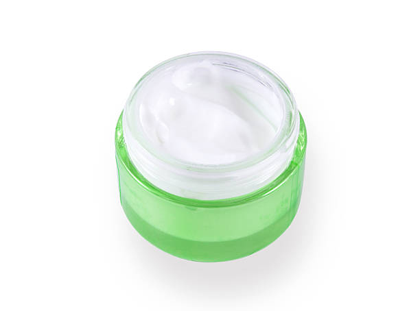 istock green glass bottles with cream 147317233