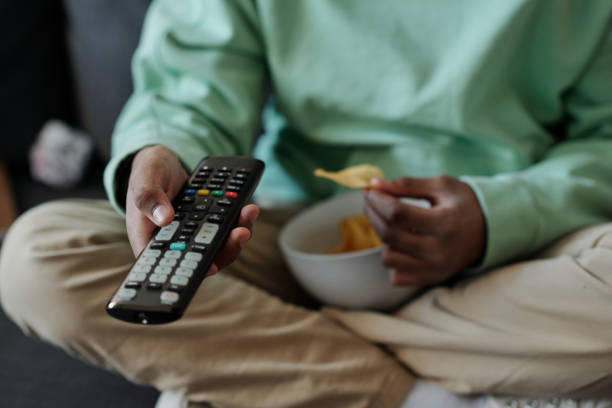 istock Selective focus on remote control held by African American schoolboy 1473173478