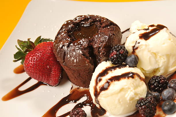 istock molten lava chocolate cake, vanilla  ice cream and fresh berries 147317966