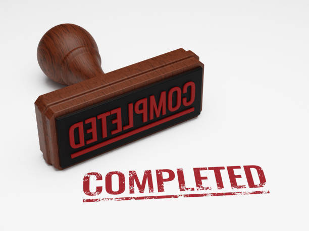 istock COMPLETED wooden stamp isolated on white background 1473181073