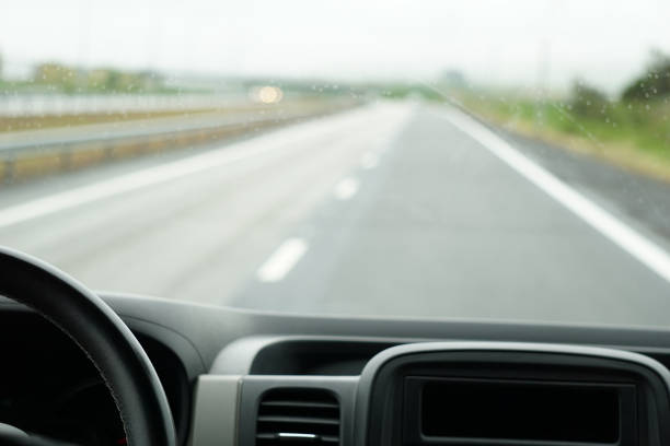 istock Driving a car on a highway - perspective of a driver 1473181352