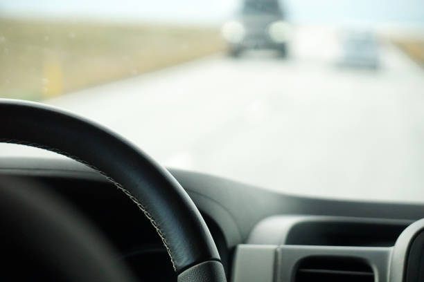 istock Driving a car - perspective of a driver 1473181417