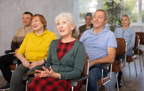 istock Interested elderly woman listening lesson during language courses 1473181644
