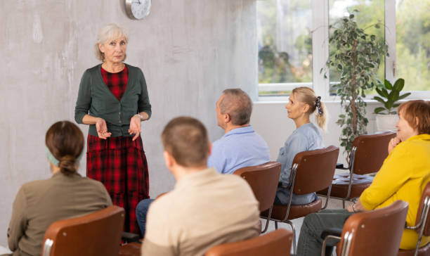 istock Female tutor leading educational class for group of elderly people 1473181709