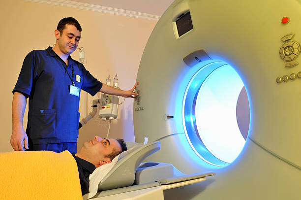 istock Technician performing  medical scan to a patient. 147318208