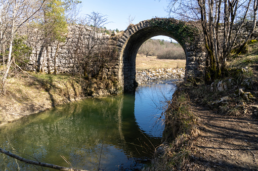 River Draga with beautiful view of the bridge which was built during the reign of Napoleon,and is famous photo and rest location on well known trail \