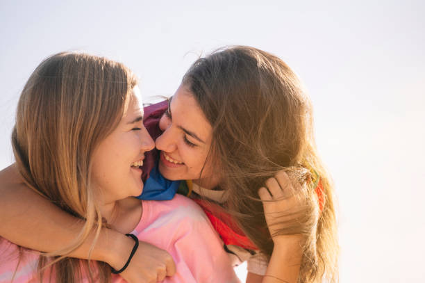 istock Two lesbian friends having fun outdoors. 1473183366
