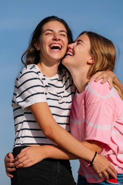 istock Two lesbian friends having fun outdoors. 1473183417