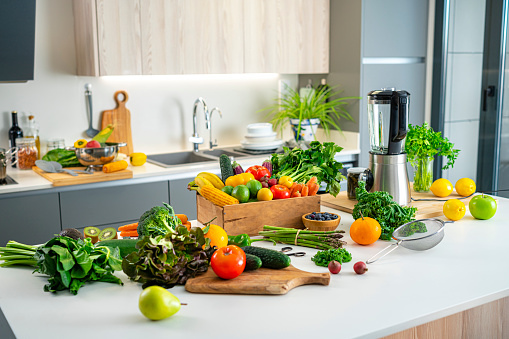 Fresh healthy fruits and vegetables shot on kitchen island. High resolution 42Mp indoors digital capture taken with SONY A7rII and Zeiss Batis 40mm F2.0 CF lens