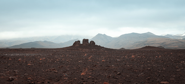 Panoramic view on group of three rocks in Icelandic highlands.