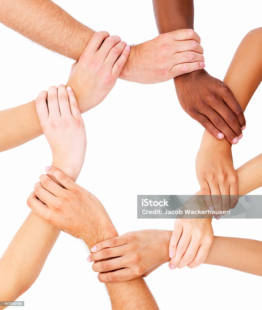 Group of human hands showing unity Hands Clasped Stock Photo