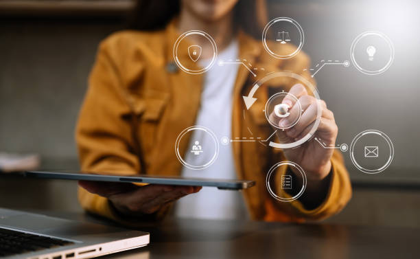 istock Copyright or patent concept, Person hand using laptop computer, tablet and smartphone with virtual screen copyright icon trademark, Creation ownership against piracy. at office 1473188095