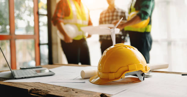 istock Engineer teams meeting working together wear worker helmets hardhat on construction site in modern city.Asian industry professional team 1473188195