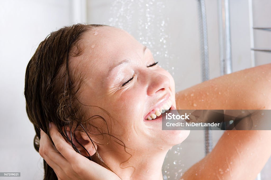 Happy woman in shower Happy young woman having fresh shower Adult Stock Photo