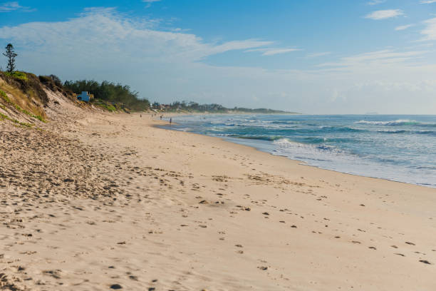 istock Sandy beach and blue ocean with waves in Floripa. Morro das Pedras beach in Florianopolis 1473191981