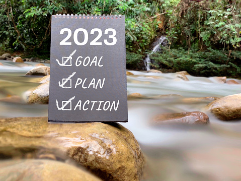 2023 goal plan action written on black board with nature background. New year resolution concept. Inspirational quote.