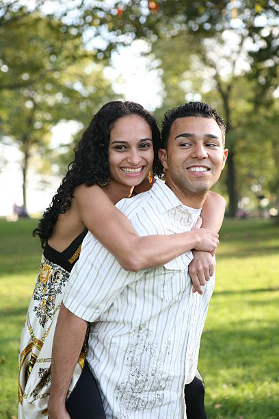 istock Happy young couple having fun in the park 147319478