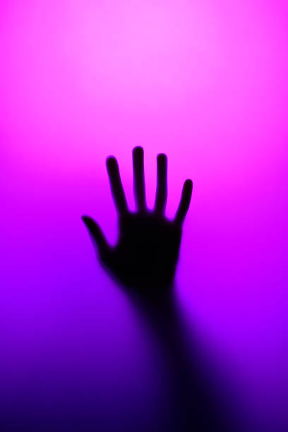 istock Silhouette of an open palm in neon light 1473195001
