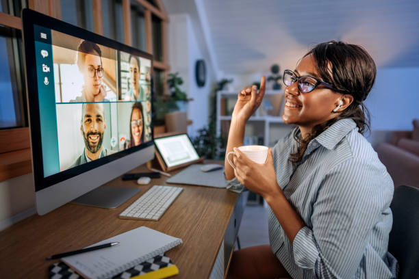 istock Young beautiful smiling businesswoman having video call while working from home office 1473196035