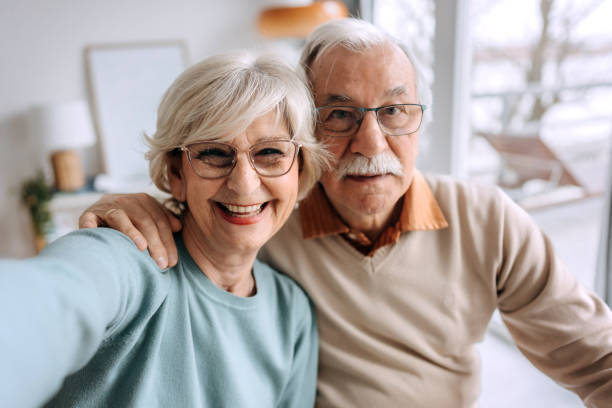 istock Senior couple selfie at home 1473198290