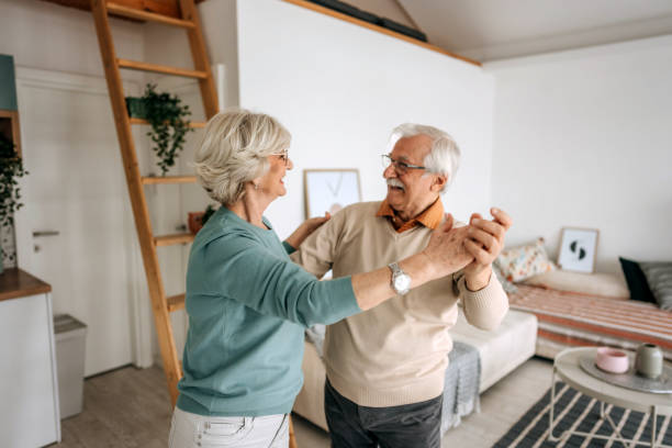 istock Cheerful retired couple dancing 1473198461