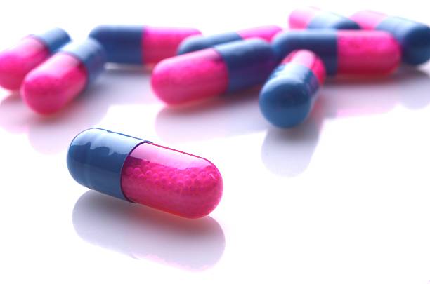 Blue and pink capsules stock photo