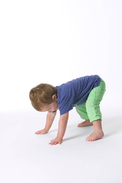 istock Toddler boy standing on hands and feet 147319953