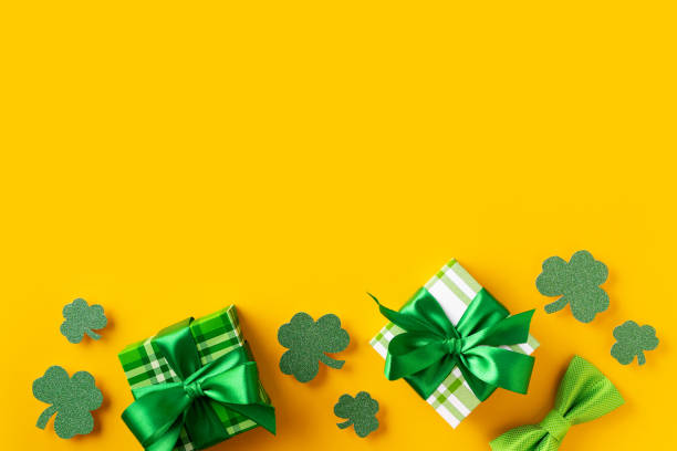 istock Saint Patrick day concept flat lay with green gift box close up on yellow background, 1473199675