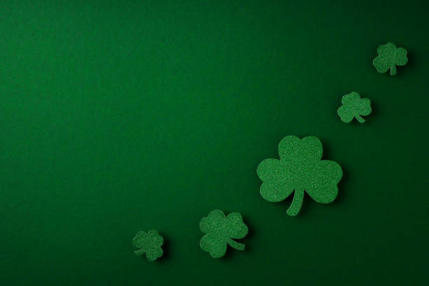 istock Saint Patrick day flat lay concept with shamrock clover on green background 1473199693