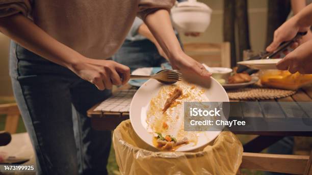 Group Of People Party At Home After Meal Eating Throw Away Leftovers Food To Plastic Bag Junk Trash Bin Net Zero Waste Go Green Eco Friendly Lifestyle Reduce Household Scrap Save The Planet Earth Stock Photo - Download Image Now