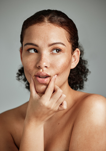 Skincare, black woman and face of a beauty model with healthy skin and facial wellness. Gray background, studio and isolated person after cosmetic dermatology detox feeling relax and calm from spa