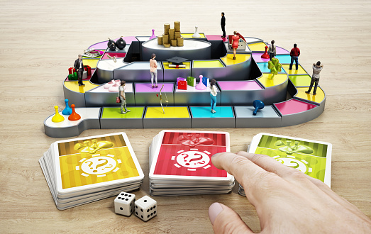 CGI objects standing fictitious board game table and colorful game cards with question mark signs. Choice and decisions concepts.