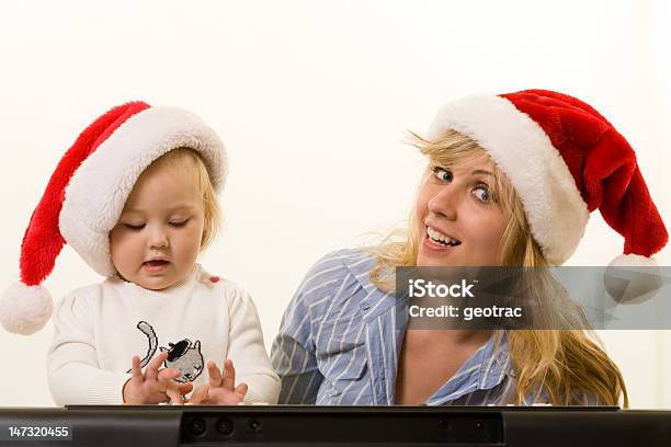 Christmas Carols Stock Photo - Download Image Now - Adult, Baby - Human Age, Baby Girls