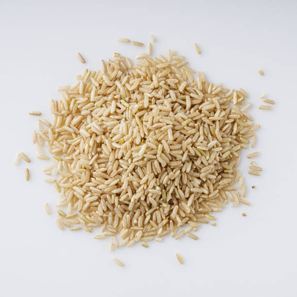 istock raw unpolished rice on a white acrylic background 1473204992