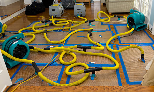 Water mitigation, disaster recovery Water mitigation pumps and dryers to suck the water out of a flooded hardwood floor damaged stock pictures, royalty-free photos & images