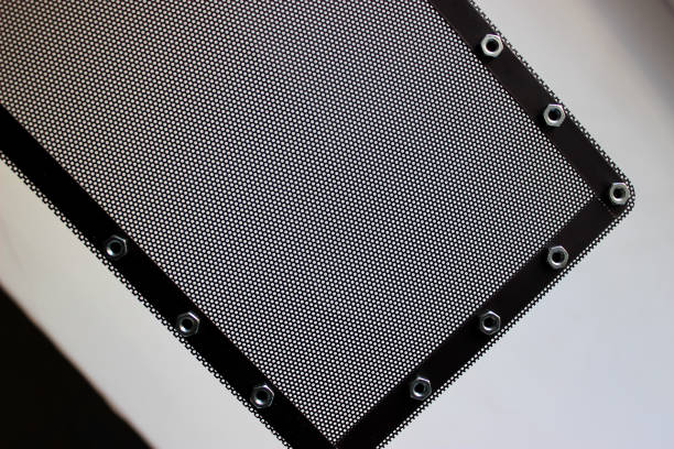 istock Pattern of protective grill with small round holes and nuts for mounting bracket on the frame isolated on white 1473207734