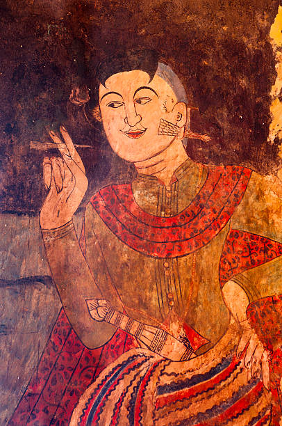 Ancient Thai temple mural background Ancient Buddhist temple mural depicting a Thai daily life scene at Wat Phumin, a famous temple in Nan province, Thailand. The temple is open to the public and has beautiful murals on the walls which were painted by Thai artisans hundreds of years ago. These beautiful ancient murals have deteriorated over the years but there are still some in good condition. painted image paintings oil paint senior women stock pictures, royalty-free photos & images