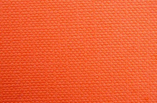 Abstract orange wrinkled paper texture background or backdrop.