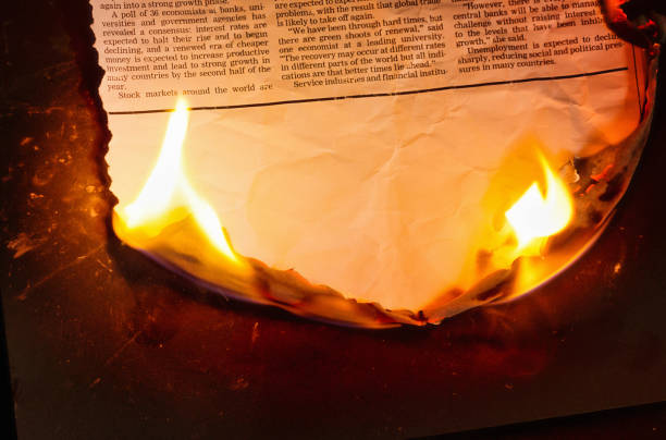 Burning simulated newspaper clipping with blank space for your copy. Text was written from scratch by the photographer, who also did the design, so this image is free of third-party copyright and may be used without restrictions.