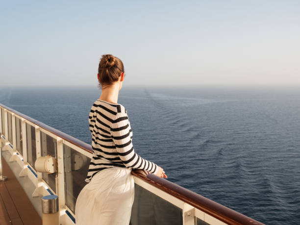 istock Stylish woman standing on the empty deck 1473214696